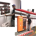 RomElectrical Pty Limited Certified Electricians working on main electrical unit on commercial and industrial sites