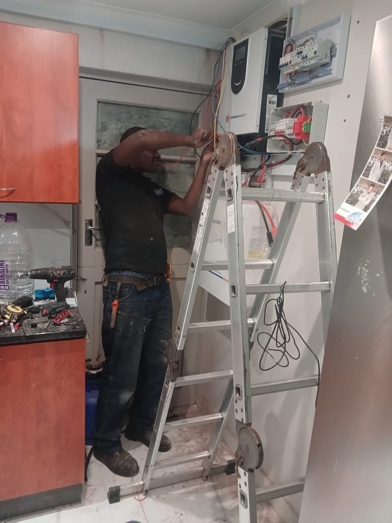 Professional electrician performing electrical installation in a Cape Town home