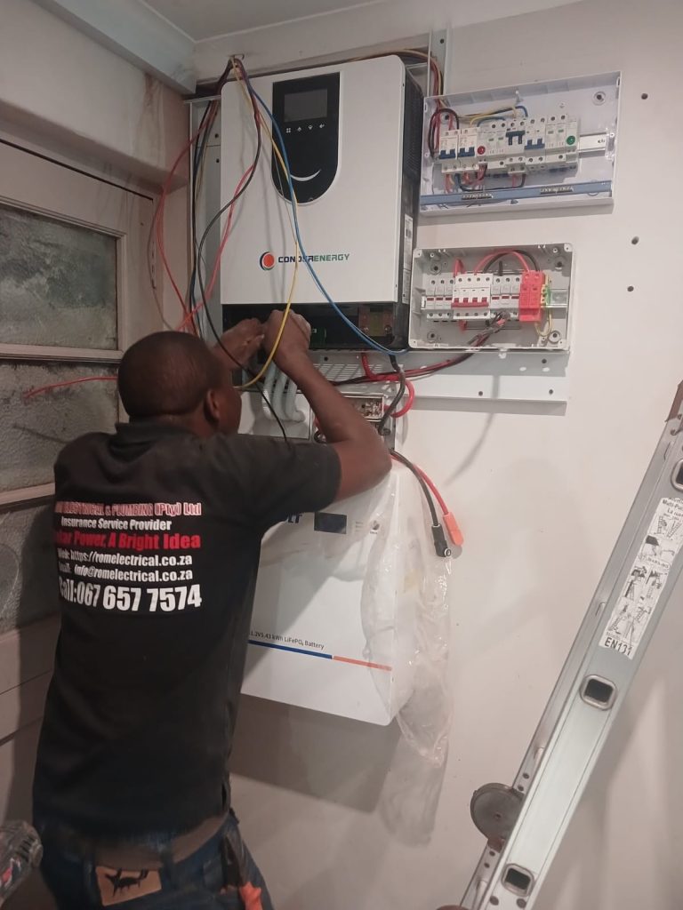 Professional electrician inspecting an electrical panel in a Cape Town property